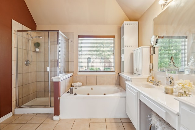 bathroom with tile patterned flooring, vanity, vaulted ceiling, and plus walk in shower