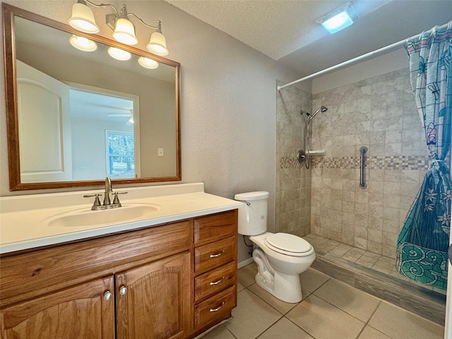 bathroom featuring walk in shower, tile patterned floors, toilet, a textured ceiling, and vanity