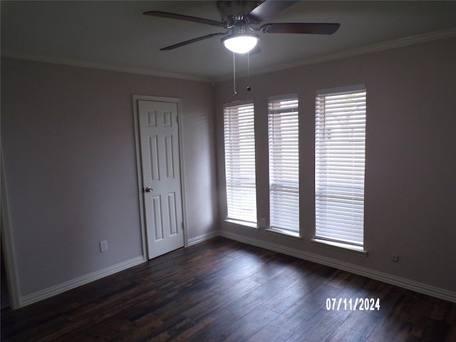 unfurnished room with crown molding, dark wood-type flooring, and ceiling fan