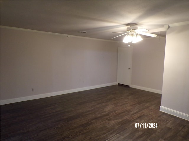 spare room with crown molding, ceiling fan, and dark hardwood / wood-style floors