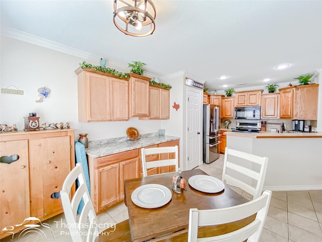 kitchen featuring ornamental molding, high end refrigerator, range, and light tile patterned floors