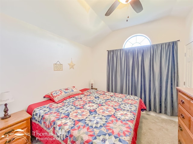 carpeted bedroom featuring vaulted ceiling and ceiling fan