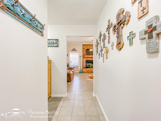 hall featuring light tile patterned floors