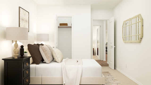 bedroom with light colored carpet and a closet