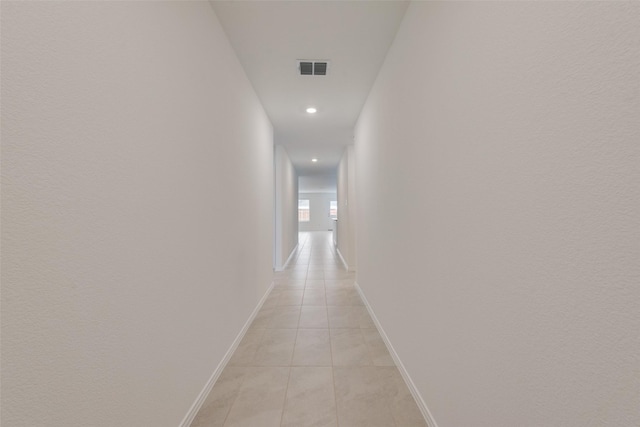 corridor with light tile patterned floors