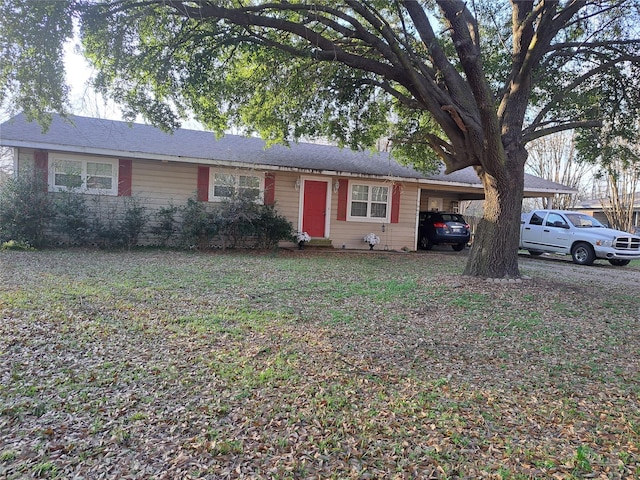 ranch-style home with a carport