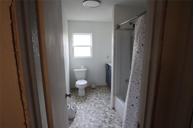 full bathroom featuring shower / bath combination with curtain, vanity, and toilet