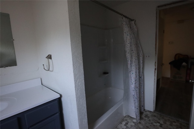 bathroom featuring vanity and shower / bath combo with shower curtain