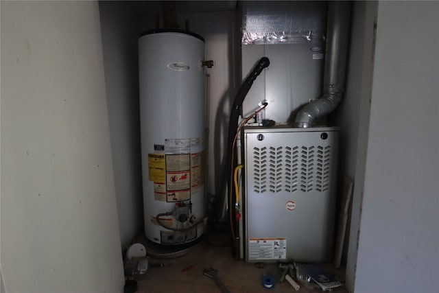 utility room featuring gas water heater