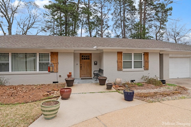 ranch-style house featuring a garage