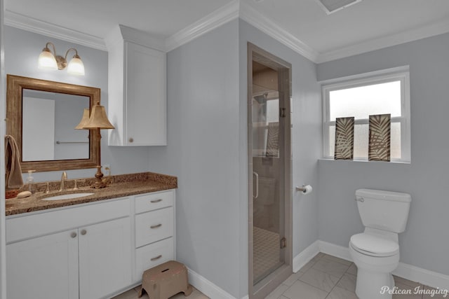 bathroom with crown molding, vanity, toilet, and a shower with door