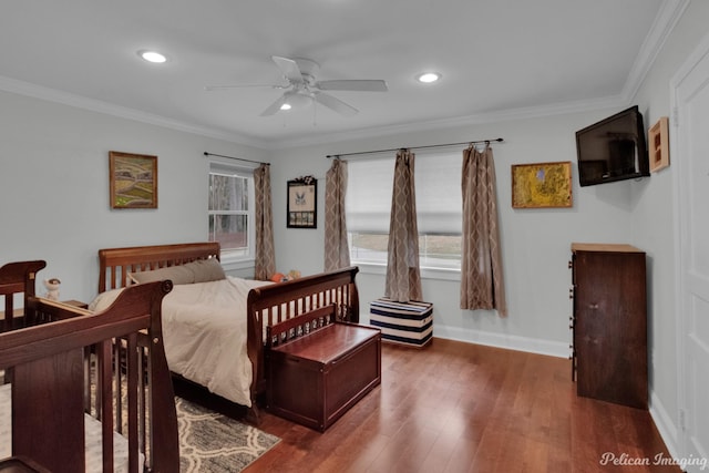 bedroom featuring dark wood-type flooring, ceiling fan, and ornamental molding