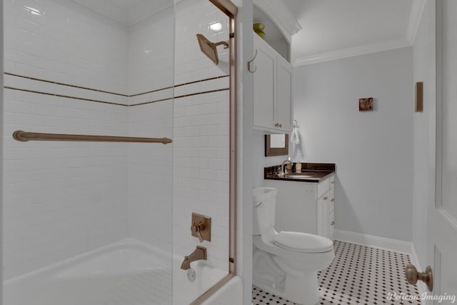 full bathroom with ornamental molding, toilet, tiled shower / bath combo, and vanity