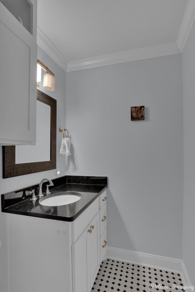 bathroom featuring ornamental molding and vanity