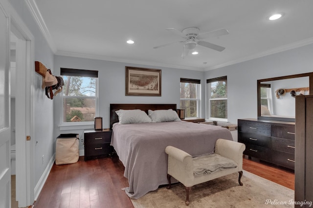 bedroom featuring hardwood / wood-style flooring, ornamental molding, and ceiling fan