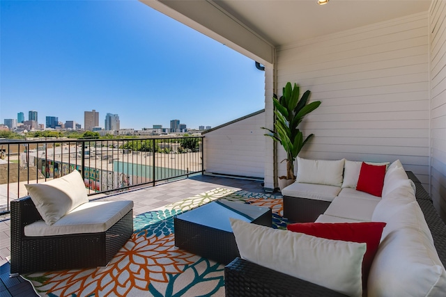 view of patio featuring a balcony and an outdoor hangout area