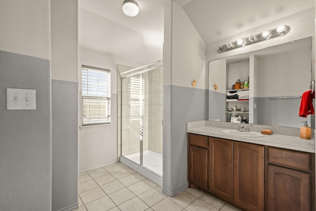 bathroom with vanity, an enclosed shower, and tile patterned flooring