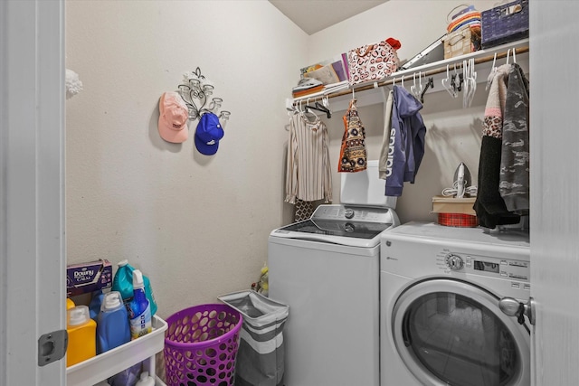 laundry room with washing machine and clothes dryer