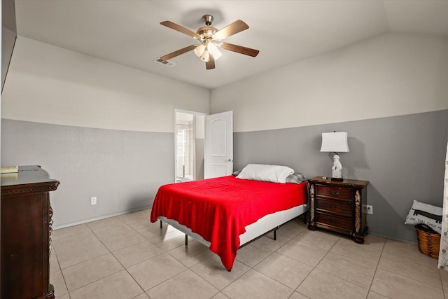 tiled bedroom featuring lofted ceiling and ceiling fan