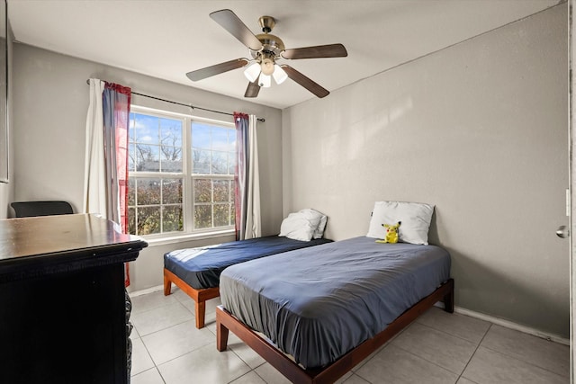 bedroom featuring ceiling fan and light tile patterned flooring