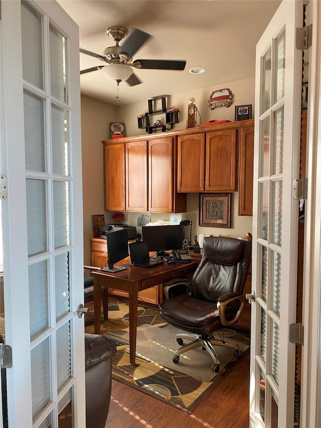 home office featuring french doors, ceiling fan, and dark hardwood / wood-style floors