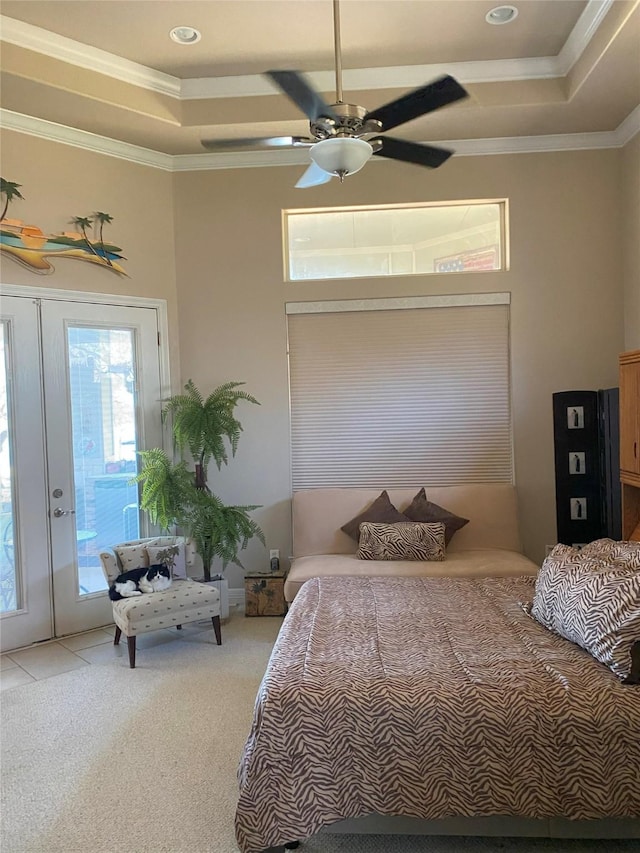 carpeted bedroom with crown molding, access to exterior, and a tray ceiling