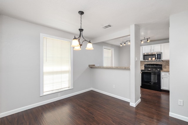 interior space with white cabinetry, black range with electric stovetop, hanging light fixtures, and dark wood-type flooring