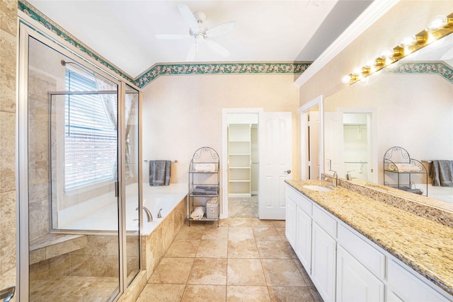 bathroom with independent shower and bath, vanity, ornamental molding, ceiling fan, and tile patterned floors