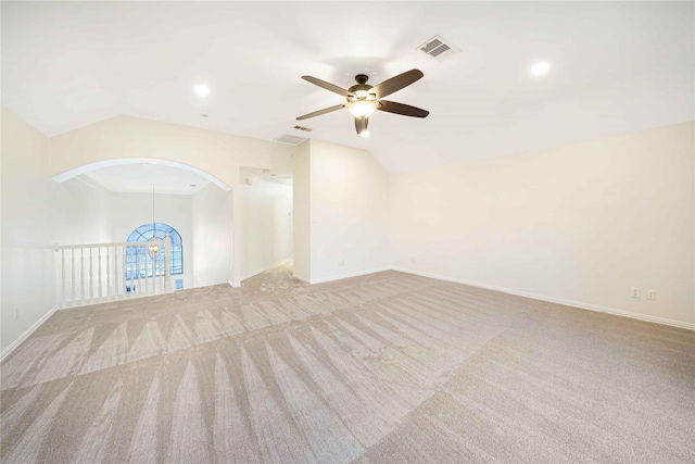 unfurnished living room featuring lofted ceiling, light colored carpet, and ceiling fan