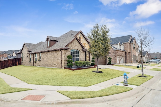 view of front of home featuring a garage and a front lawn