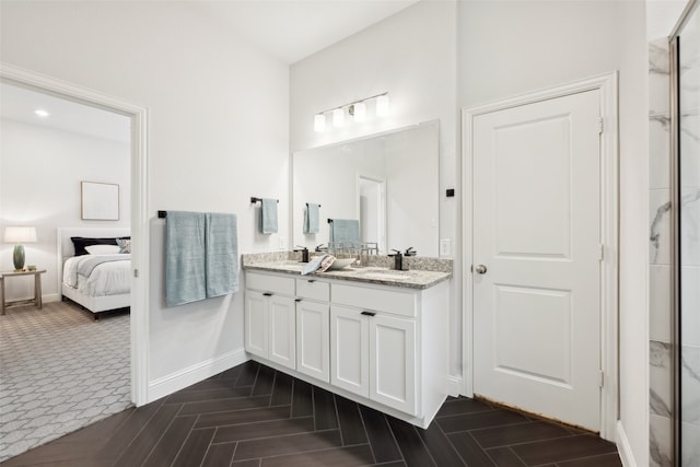 bathroom featuring vanity and parquet flooring