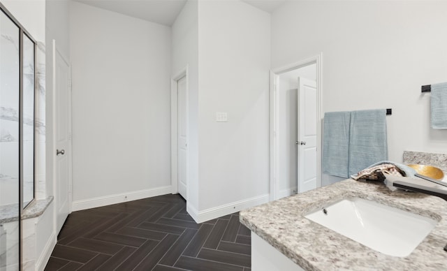 bathroom with vanity and parquet floors