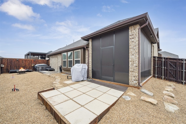 view of outbuilding featuring a hot tub