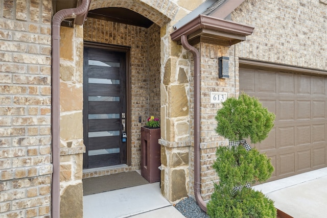 doorway to property featuring a garage