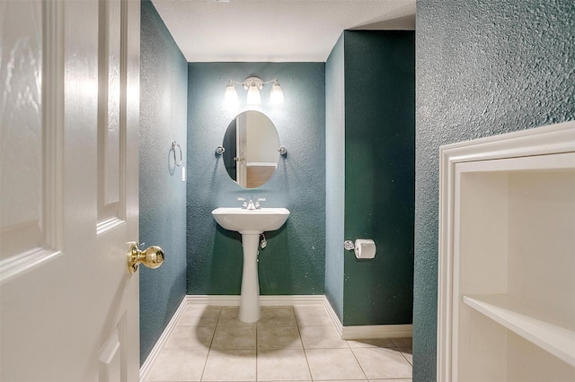 bathroom with tile patterned floors