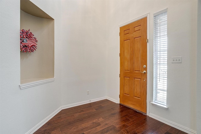 entryway with dark hardwood / wood-style floors