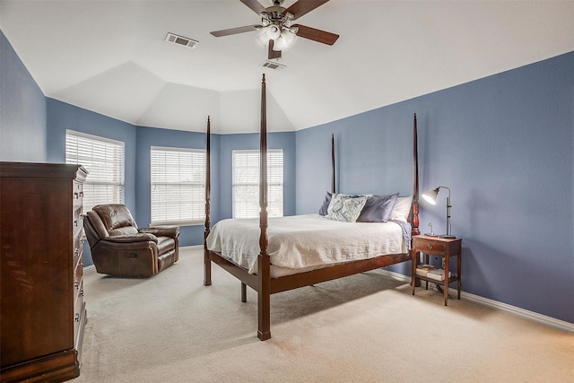 bedroom with ceiling fan, lofted ceiling, and carpet flooring