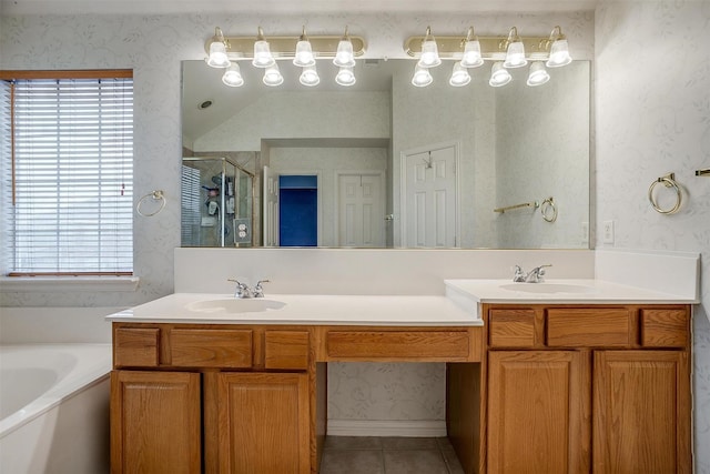 bathroom featuring vanity, independent shower and bath, and tile patterned flooring