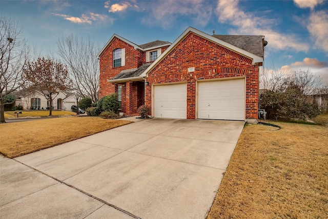 view of front property with a garage and a front lawn