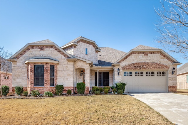 view of front of house with a garage and a front yard