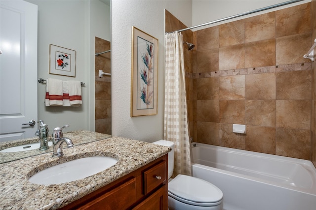 full bathroom with vanity, shower / tub combo with curtain, and toilet