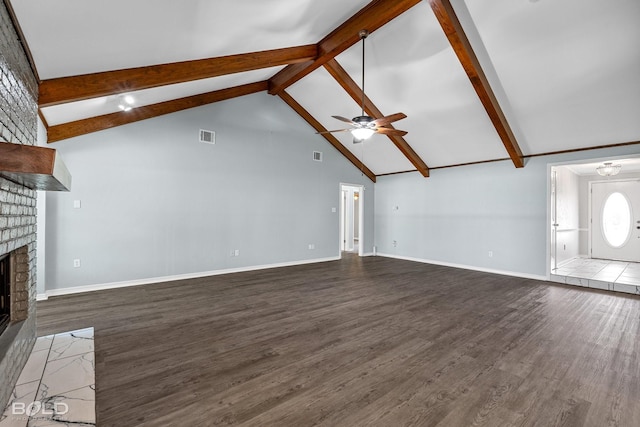 unfurnished living room featuring dark wood-type flooring, ceiling fan, a fireplace, and beamed ceiling