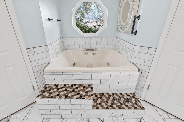 bathroom featuring a relaxing tiled tub