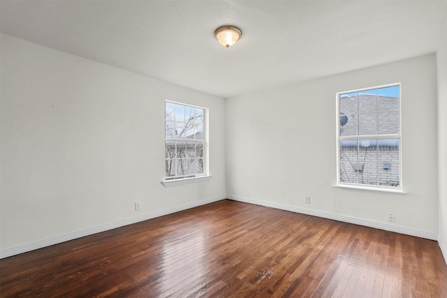 empty room featuring dark hardwood / wood-style floors