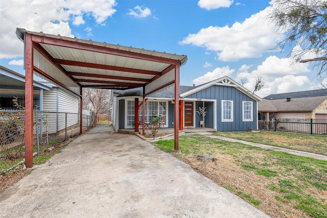 view of front of house with a front yard and a carport