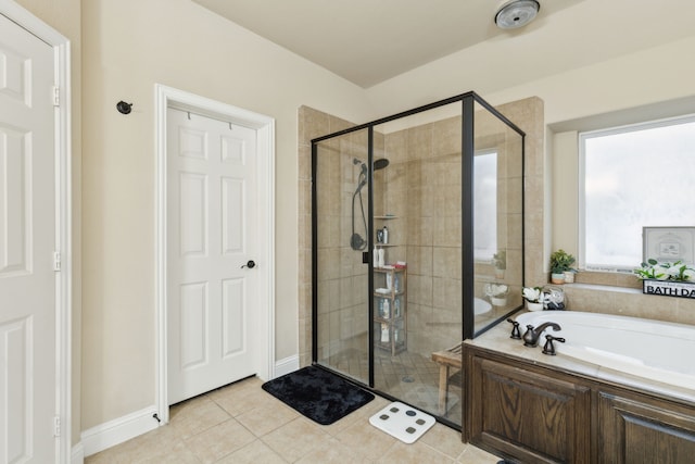 bathroom featuring plus walk in shower and tile patterned flooring