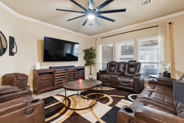 living room featuring ornamental molding, ceiling fan, and light hardwood / wood-style flooring