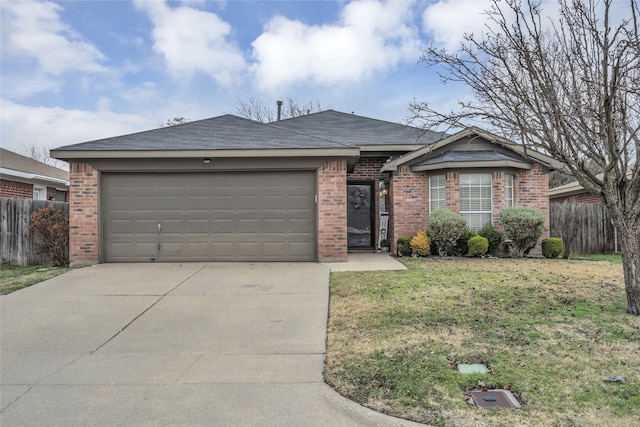 ranch-style house featuring a garage and a front lawn