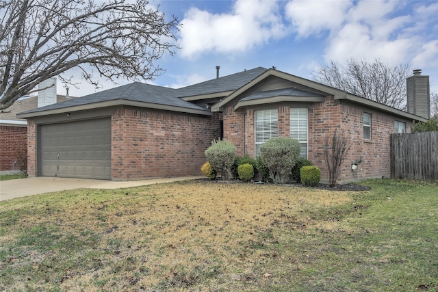 single story home featuring a garage and a front lawn