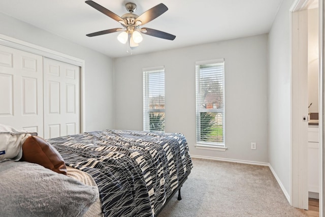 3404 Peachtree Ln, Pantego, TX 76013 - bedroom featuring a closet, baseboards, ceiling fan, and light carpet